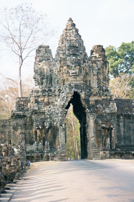 Still at the south gate, but over on the other side of the road to show the city's 75-foot entrance tower, or gopura. Atop the tower, four f