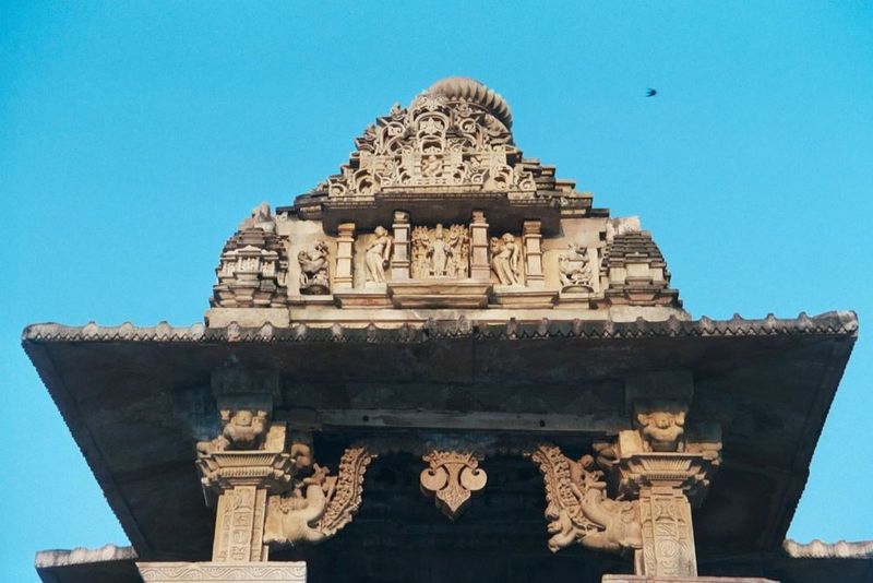 This is the entrance to the Lakshmana vestibule, showing the temple's pyramidal roof the jagamohan or phamsana and a pair of flamboyant maka