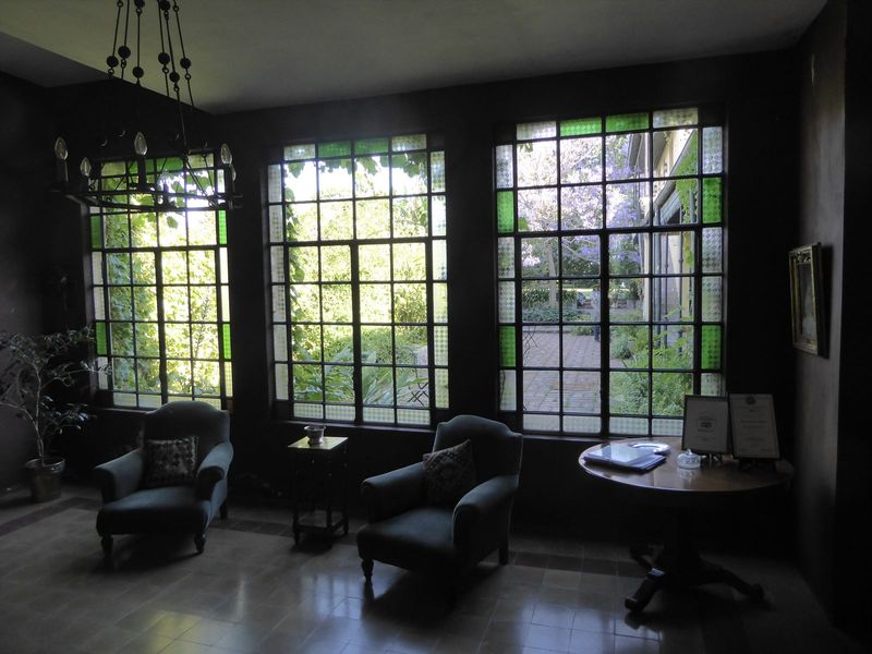 The main room has a view into a deep yard.