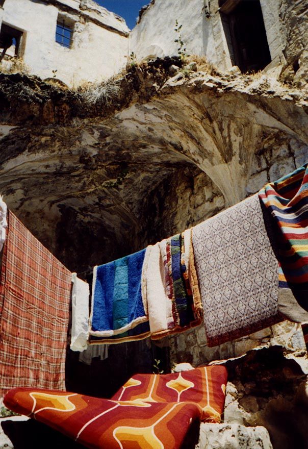 Until the mid-1990s, much of the old city was in a state of advancing ruin, like the broken domes that here rise over bedding put out to air