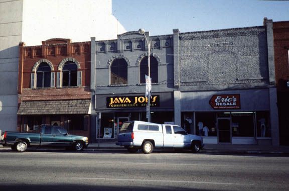 Main Street crossed and crosses the tracks perpendicularly a block north of the station, and it was platted with a width of 100 feet. For th