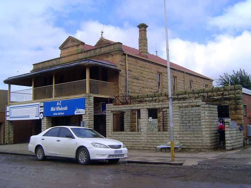 Some old buildings survive in reduced circumstances.