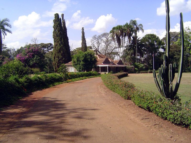 Just shy of ten miles southwest of downtown Nairobi, in the district now known as Karen, the traffic drops off and the house comes into view