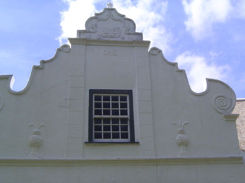 It took almost a century before the church had a town around it. Here's the roller-coaster gable on a nearby house on De Jongh Lane.
