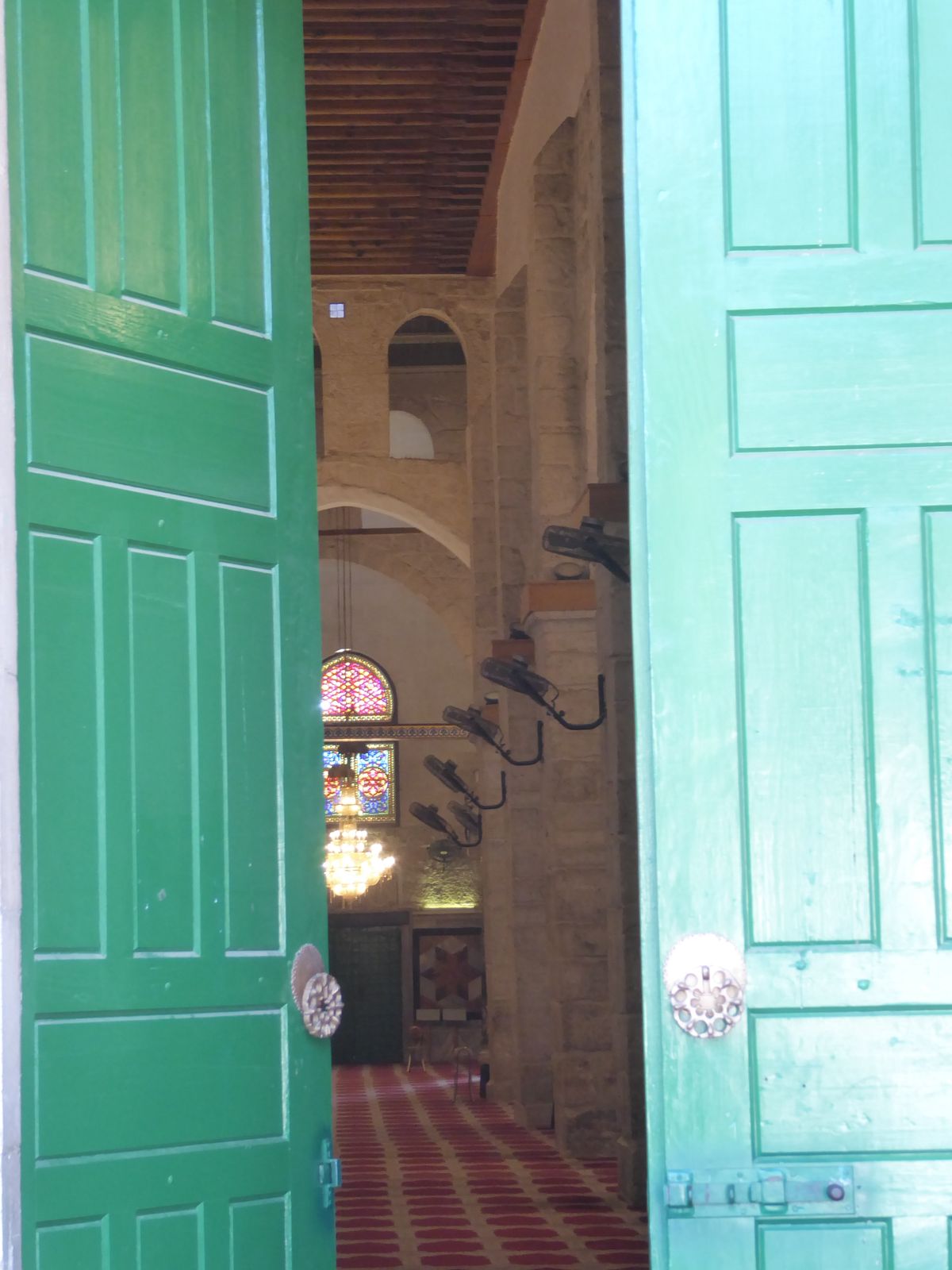 A peek inside, with columns donated by Mussolini and ceiling paintings from Egypt's Farouk. Nothing remains of the original mosque. Were its
