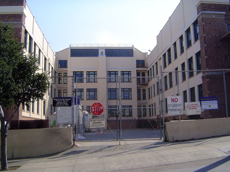 Behind the building was this courtyard, a scene of countless high-school rallies. A massive fire escape has been removed, and the fencing se