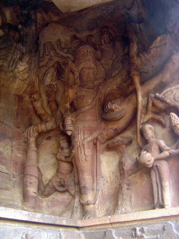 Trivikrama, an avatar of Vishnu. The story is that Vishnu appeared as a Brahmin before a demon named Bali and asked for the land he could em