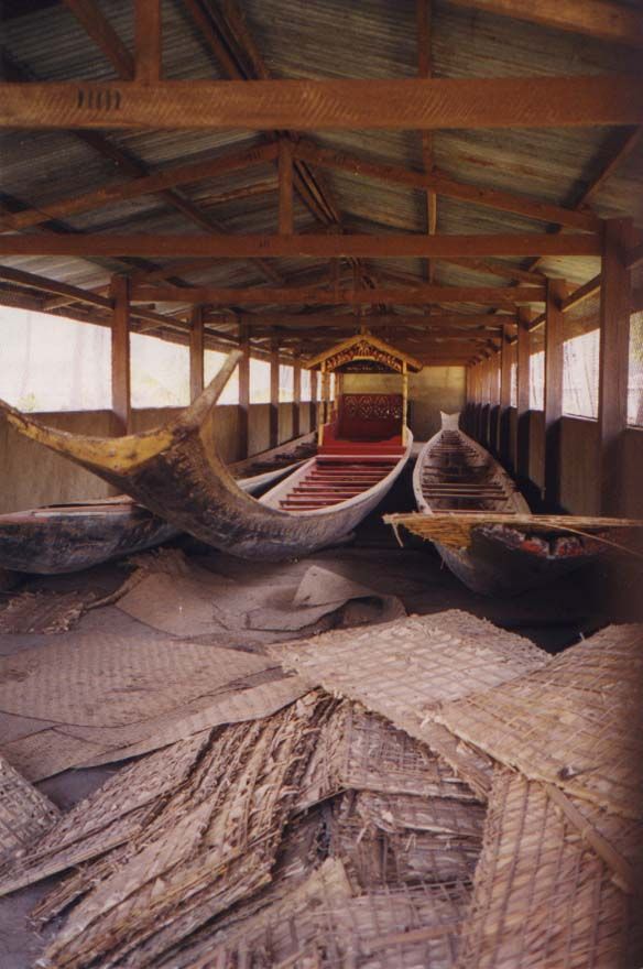 At the south side of the palace grounds, a shelter protects immense royal canoes.