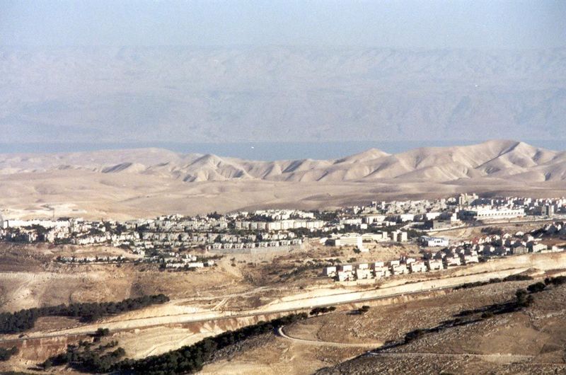 The Dead Sea, on an unusually clear day, looms behind Ma'aleh Adumim, a settlement east of Jerusalem—and the West Bank's biggest. The town w