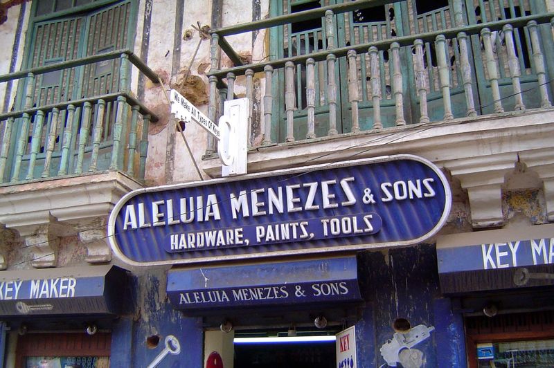 Even when the signs are English, the shop names often hint of the Portuguese past.