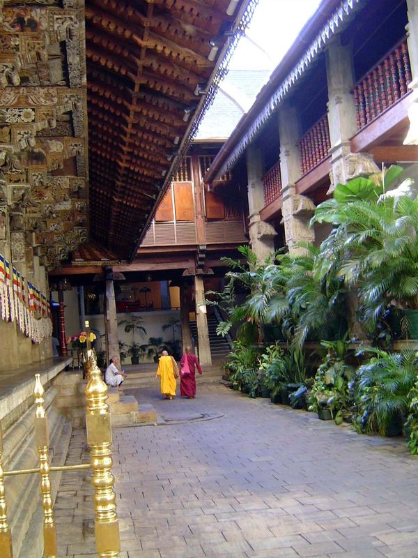 The original temple stands in a courtyard. Build of wood, though supported by granite columns, it rests on a granite-block platform. The sta