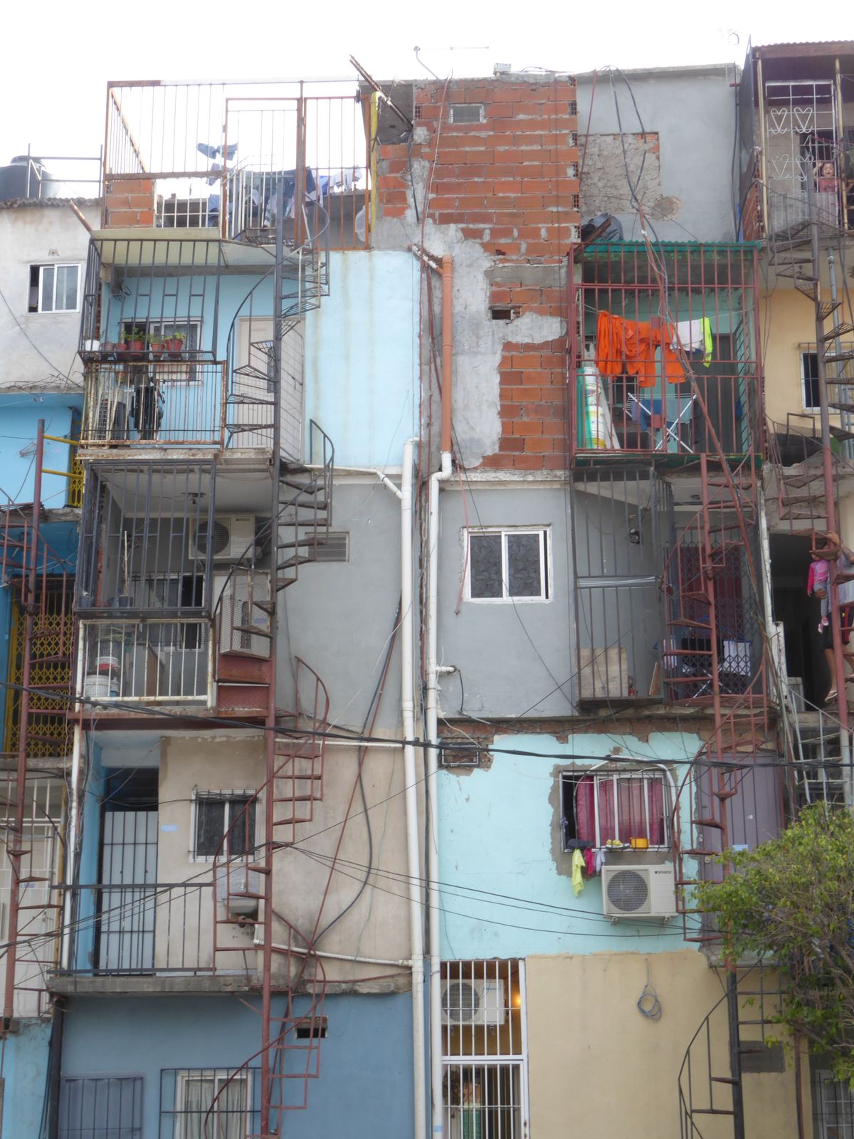This one reaches extraordinary heights, with the space-saving device of external, spiral stairs.