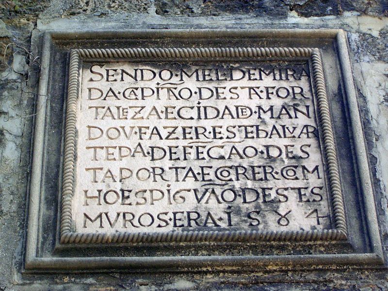 The inscription states that the adjoining Tower of St. Peter's was built by order of Manuel de Miranda, captain of the fort and the town, to