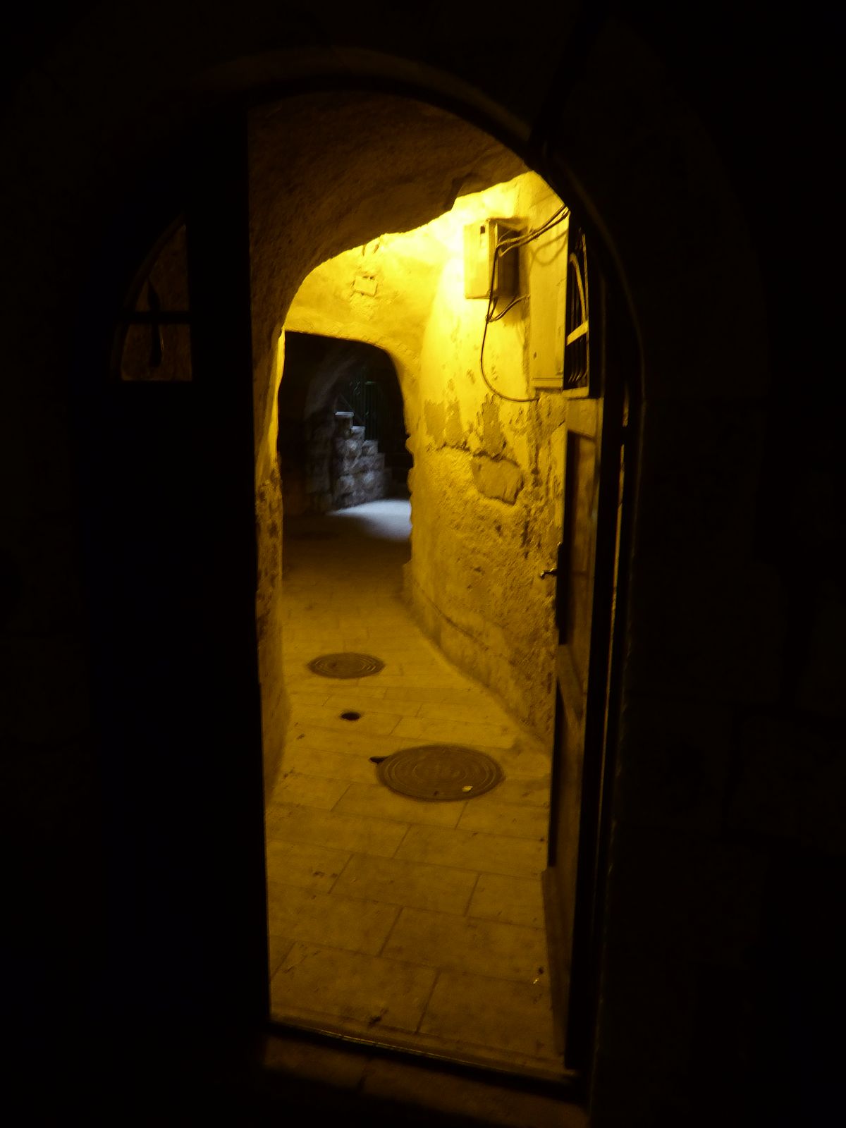 The paths lead to courtyard houses invisible until a door opens. In this case the recent improvements include not only sewer lines but stree