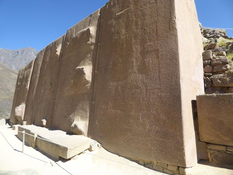 These blocks are unusual on several counts, not least the now-eroded carving on the faces.