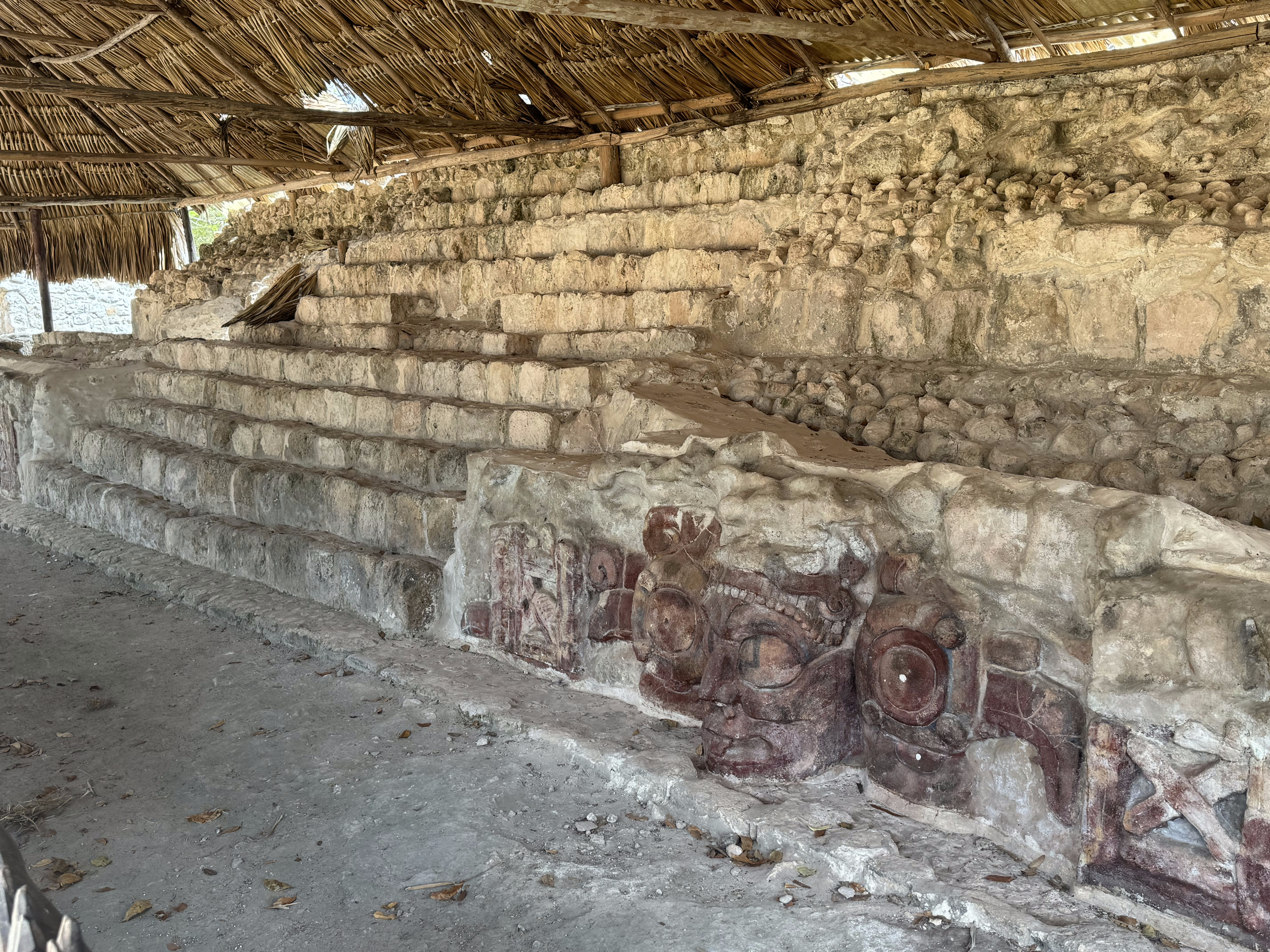 It's so-named because two stucco masks were found during excavation in 1988.