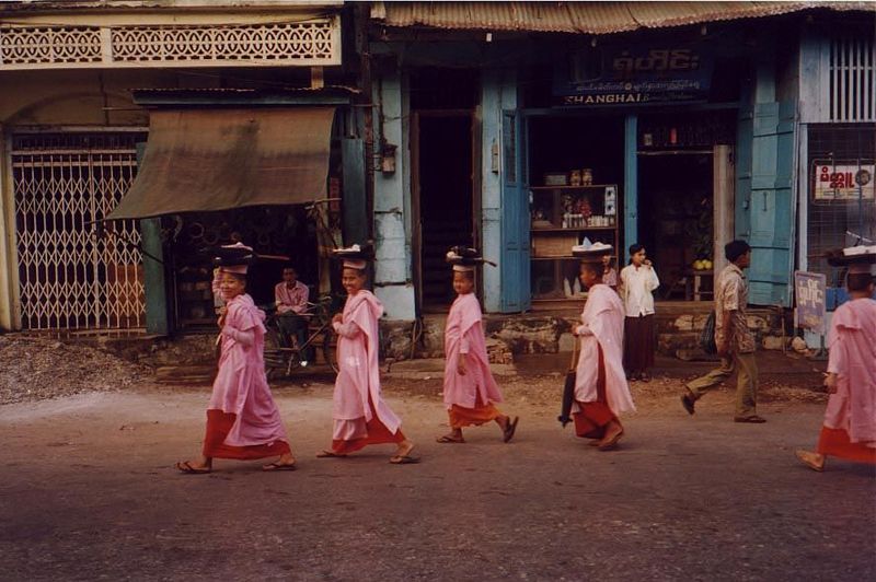 Buddhist nuns grace an otherwise grim street scene.