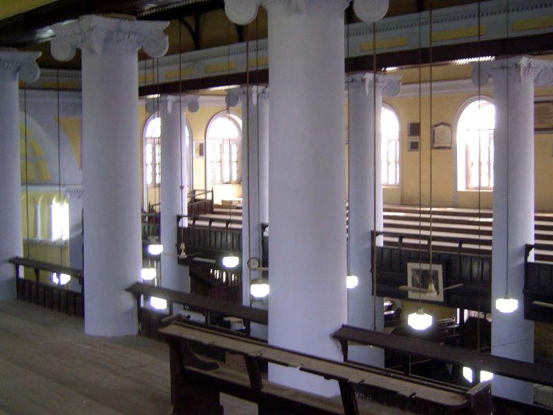 Looking across from one balcony to the other. Notice the black beams running from capital to capital.