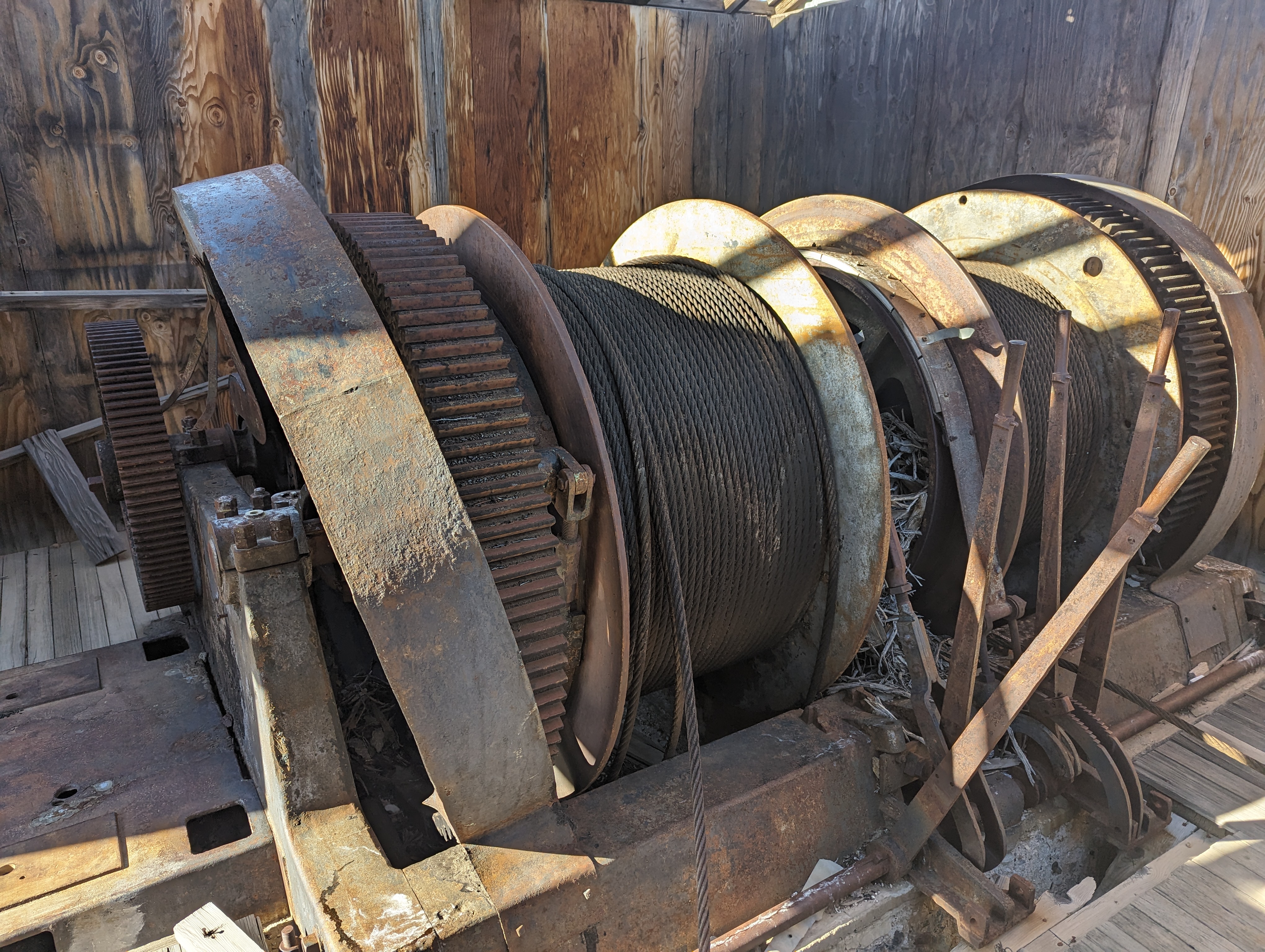 There's one surviving building atop the hoist, and it contains this spooling machine.