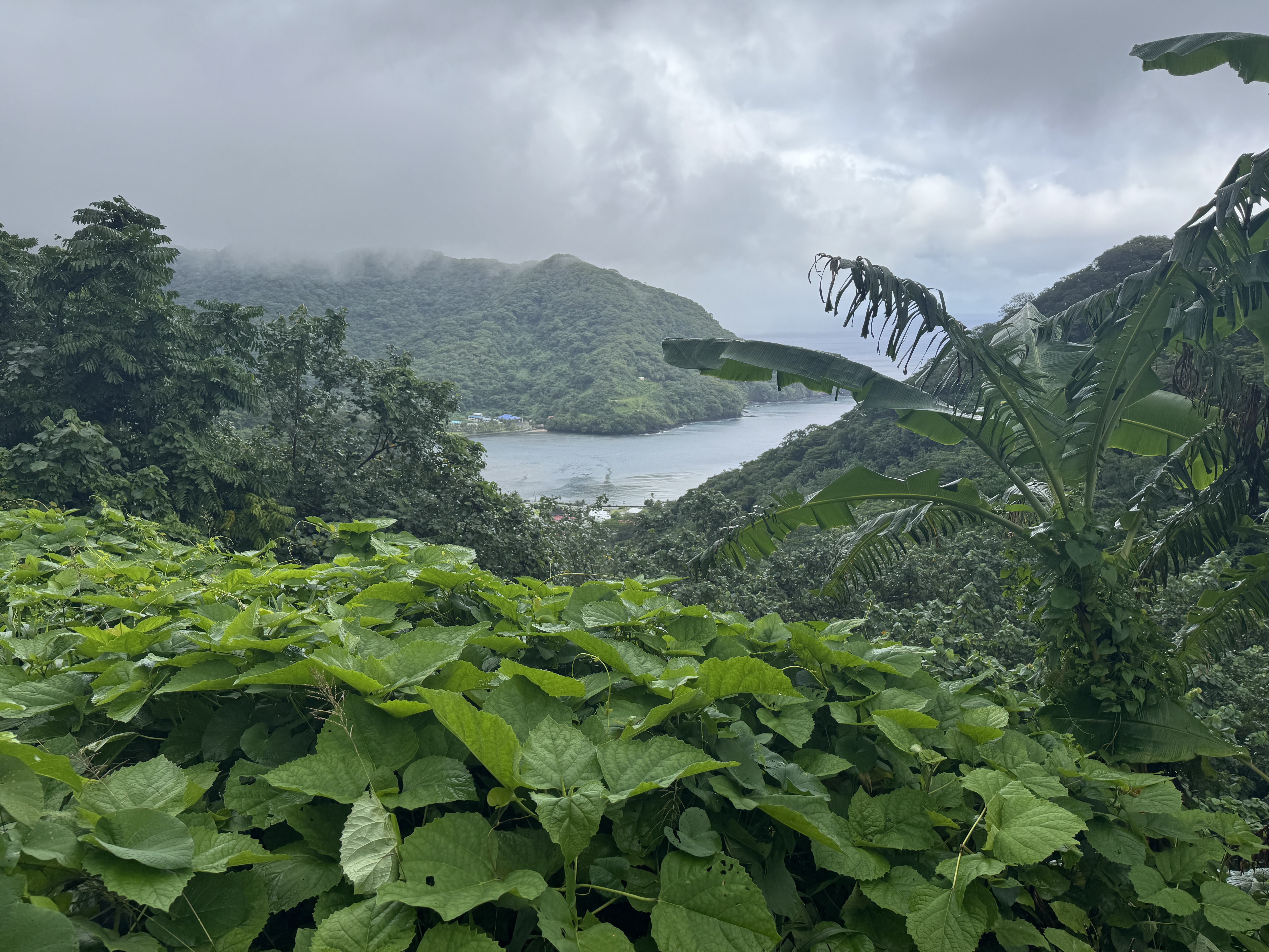 Pago Pago is behind us.  In front of us: another bay and village.