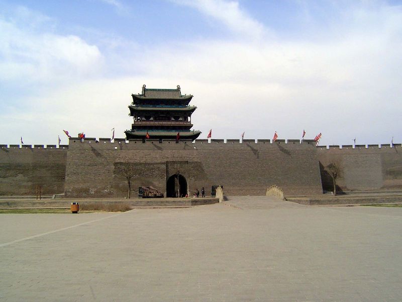 Before we go in, we'll do a bit of a circuit, here with the southern or Ying Xun Gate, built in 1703. The immense modern plaza is yet anothe