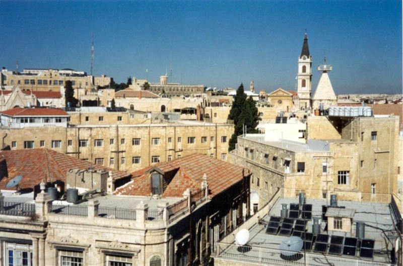 The tower of the Coptic Church of St. George rises above the general level of the city, which is dominated here by 20th century buildings an