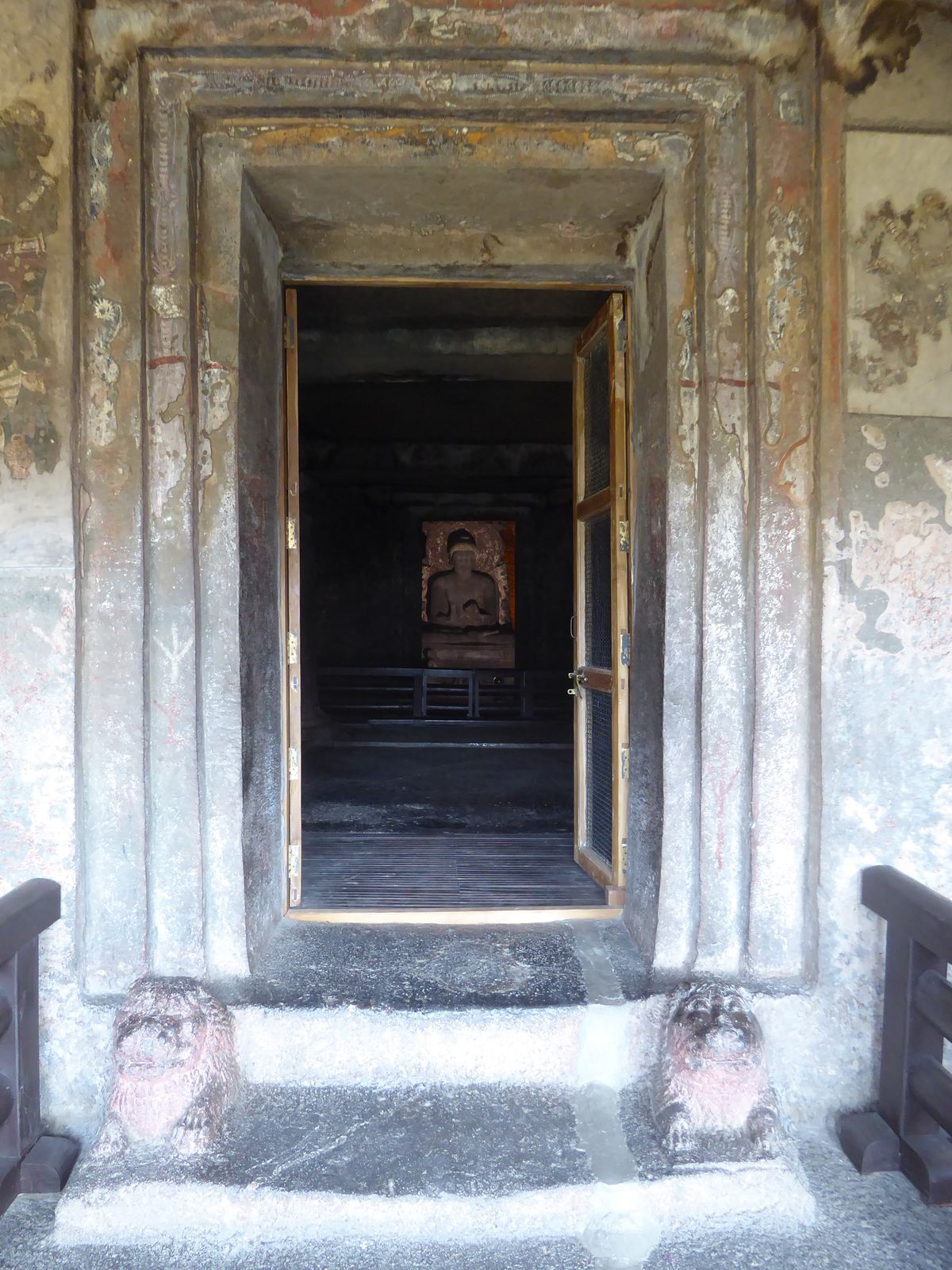 Here's Cave 11, with handsome lions at the door.