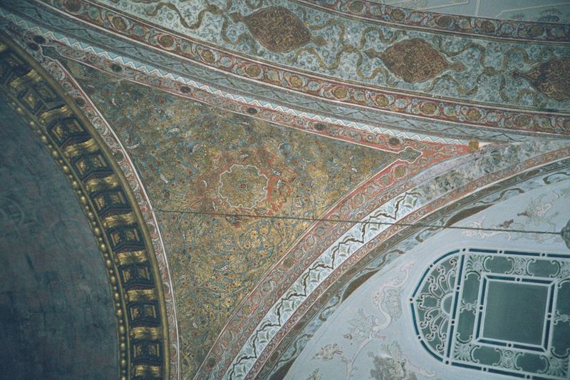 The rooms are domed, however, and the domes are mounted on decorated pendentives like this one in the Imperial Hall.