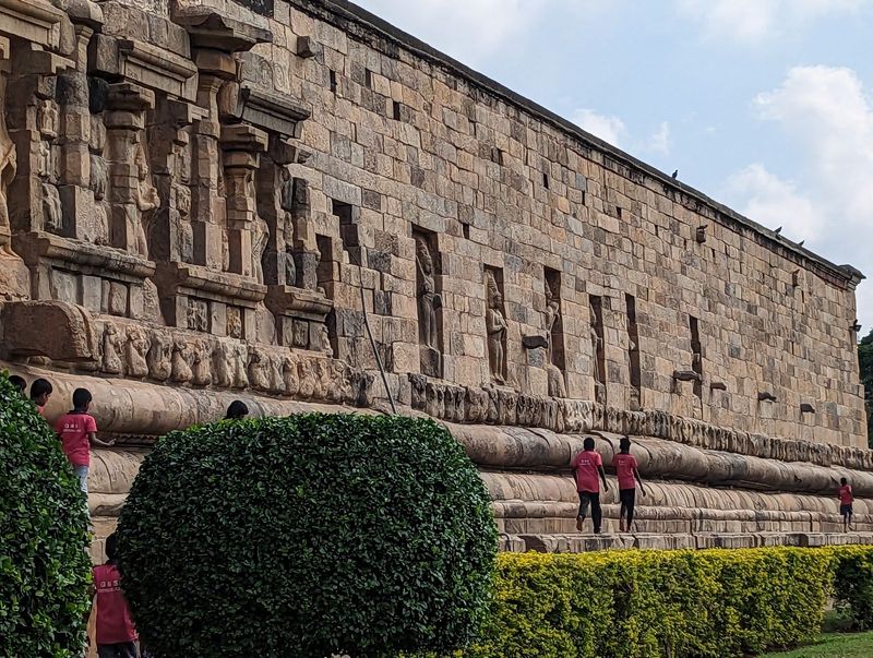 They were having fun running along the temple base, much to the annoyance of a maintenance crew.