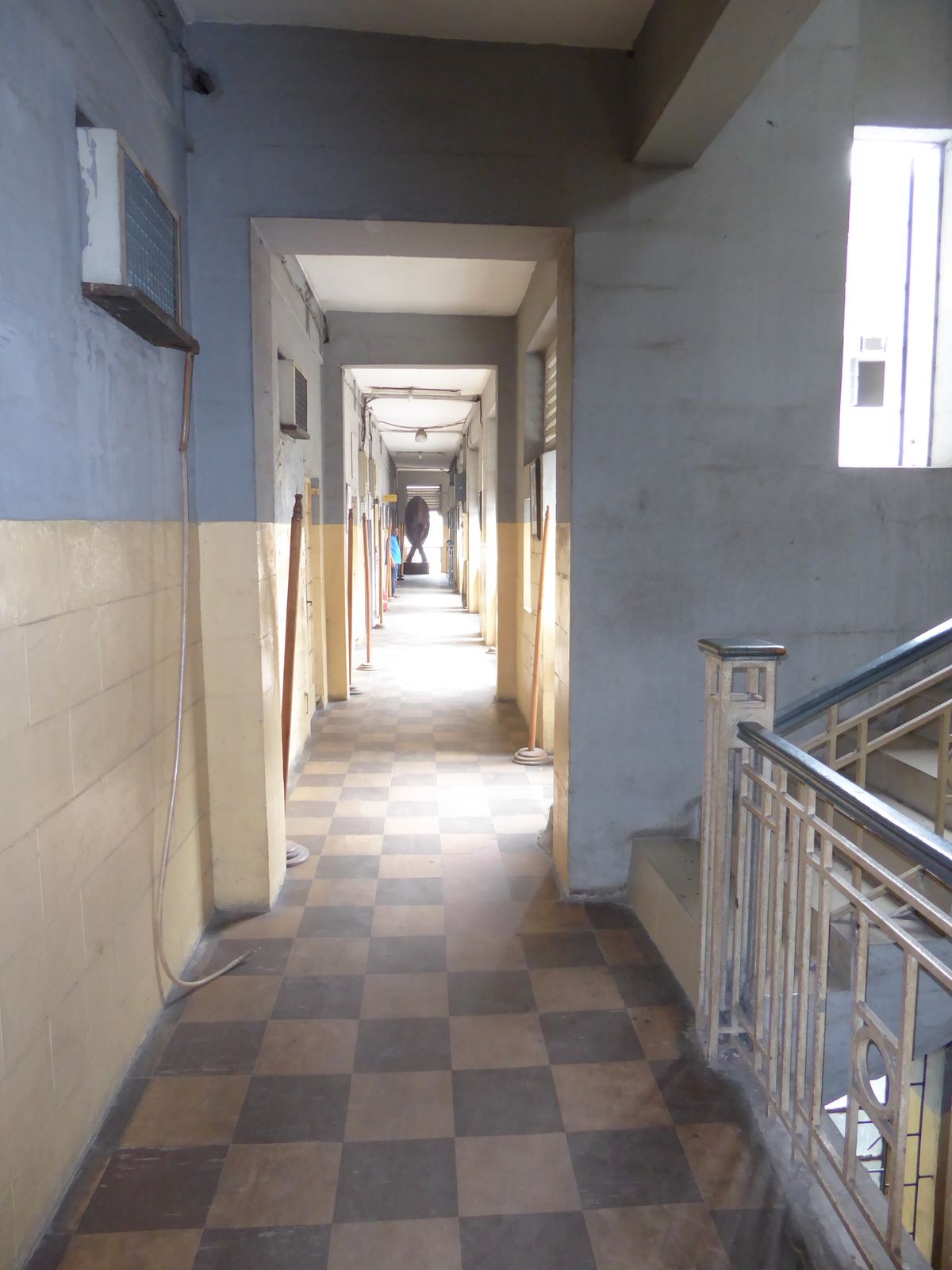Here's the main corridor of the same building, built by a public works department poor either in funds or imagination. The sculpture at the 
