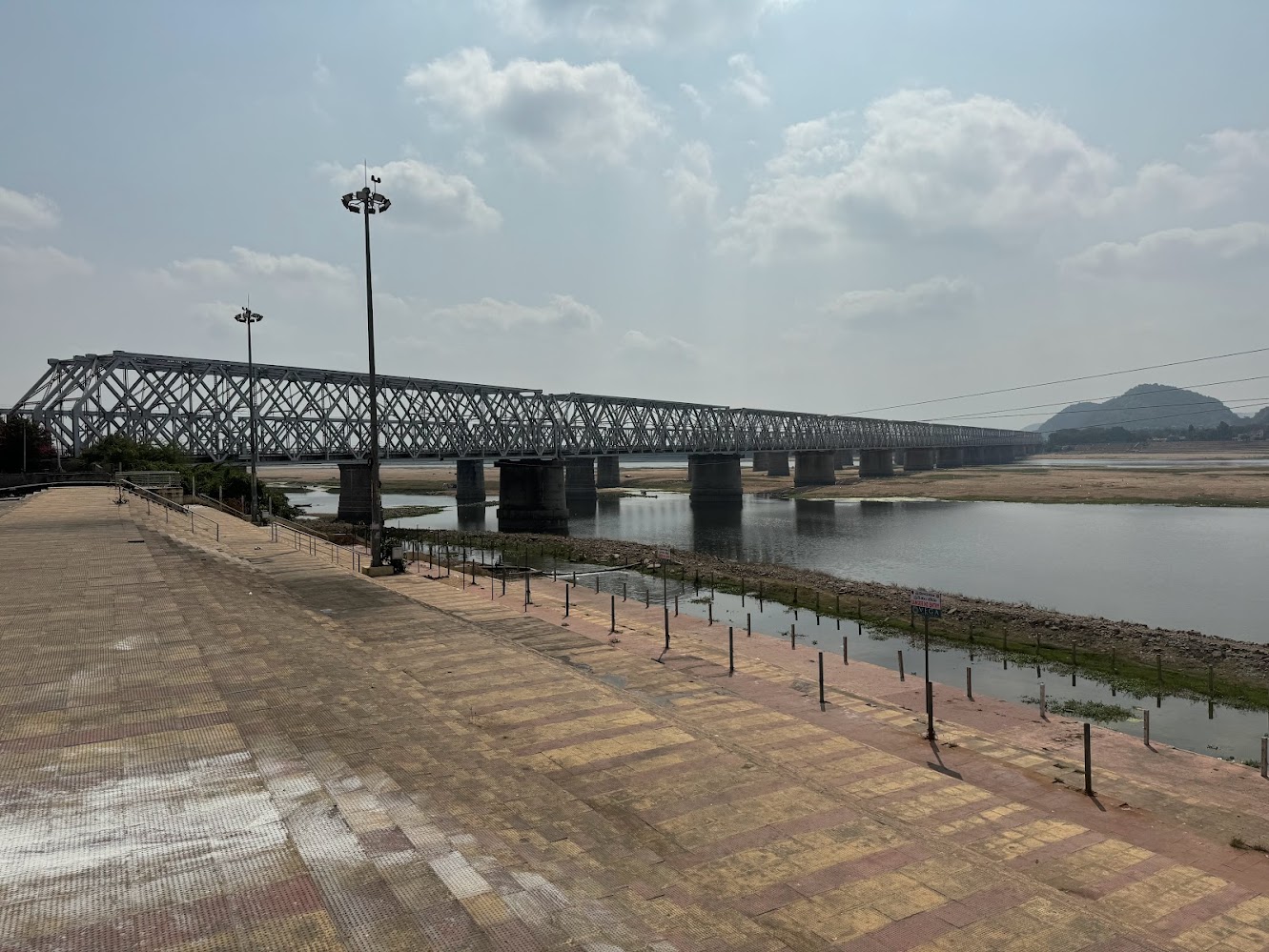 Just downstream from the dam there's a pair of railroad bridges forming part of the connection between Kolkata and Chennai.