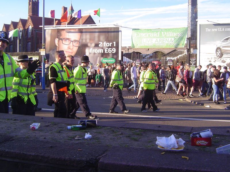 We'll take care of that! A line of police clears the street after St. Patrick's Day festivities, 2014.