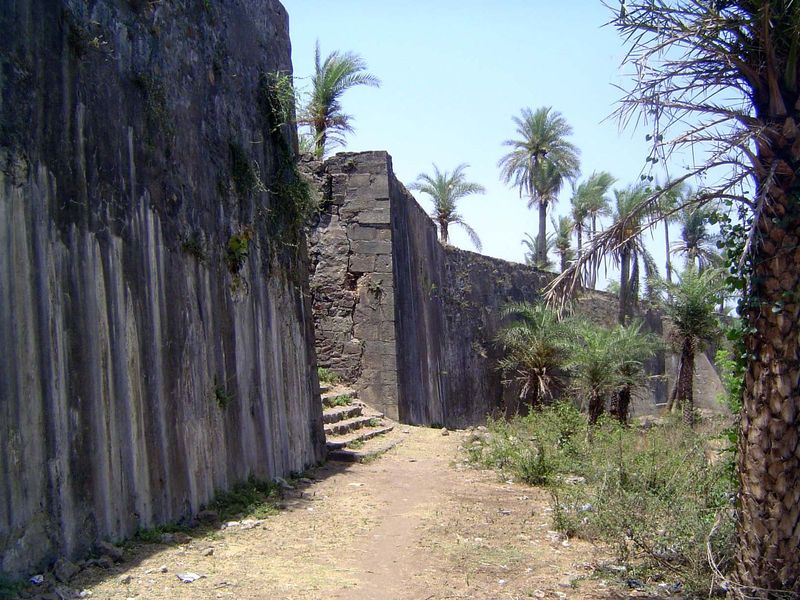 The inside of the wall of Bassein Fort, with a broad staircase to the top.