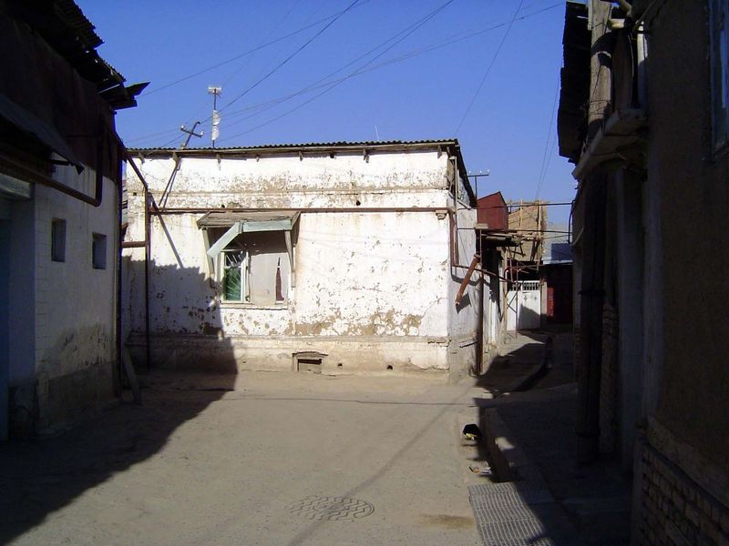 We could wander through the old city's streets. Here, a relatively wide one, with typically elevated gas mains.