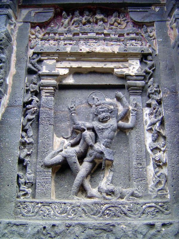 The base of the temple on this side contains several dramatic images. Here, Narasimha Vishnu's fourth or lion incarnation fights to free the
