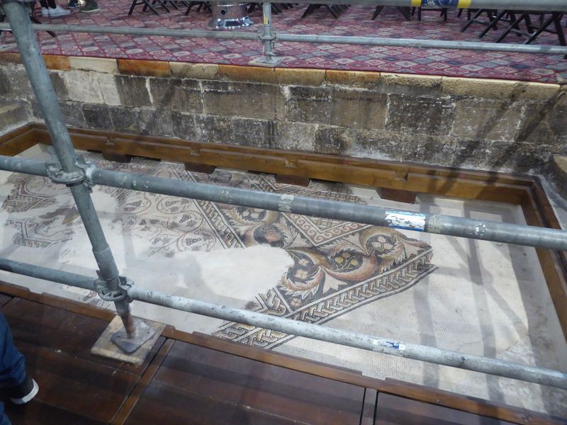 Fourth-century mosaics from the floor of Constantine's church are partly exposed.