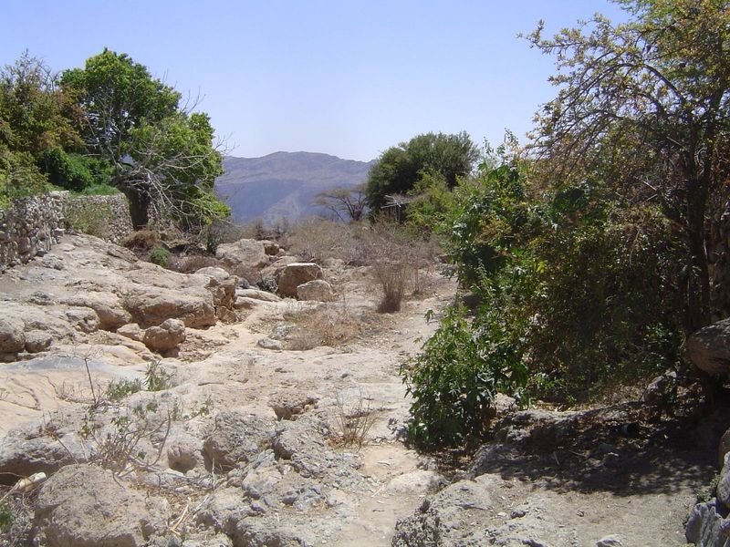 The natural channel from the spring to the valley wall.
