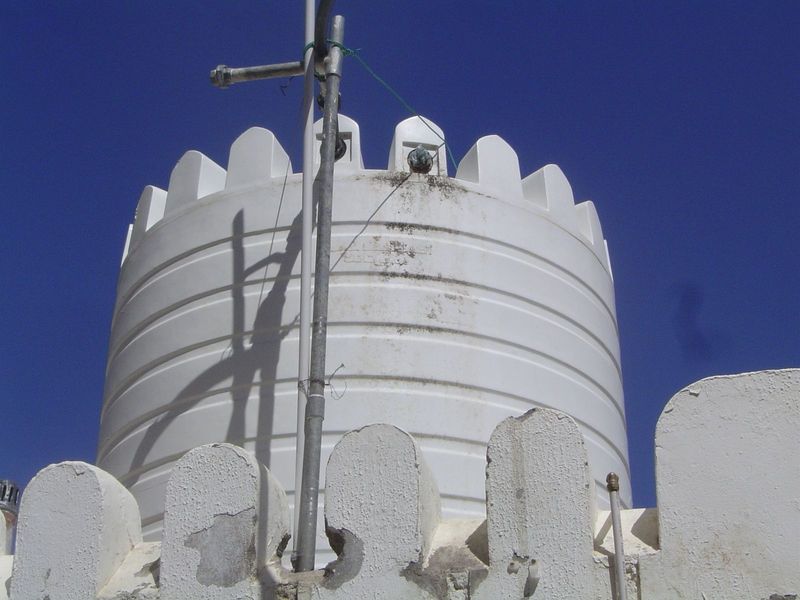 The mosque's water tank, in the plastic-castle tradition.