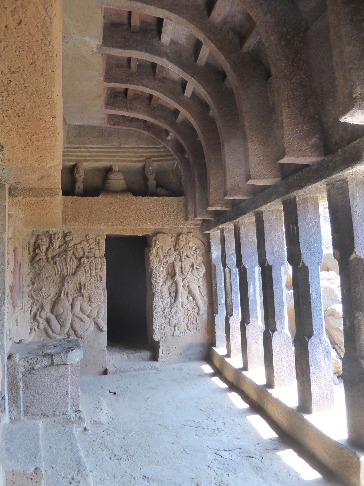 So the columns are ASI work, as are the curved beams, which are absent in old photographs. The figures on the wall are old, however, and the