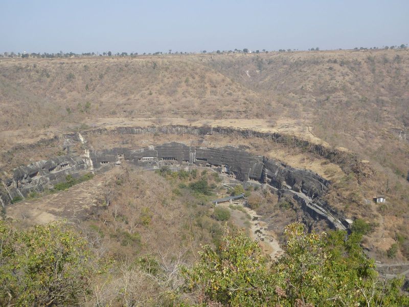 Caves 1 and 2 are at the downstream end of the line.  You can also see the two oldest chaityas, Cave 9 and 10, which are just above the brid