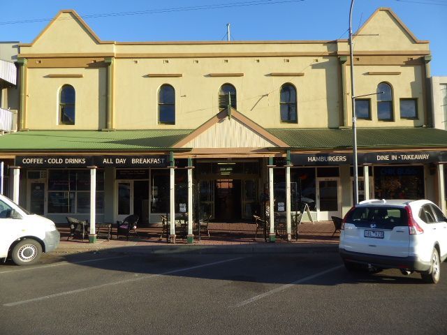 We're back on Argent Street to look at the Exchange Arcade, where mining shares were bought and sold. The verandah was installed in 1989, an