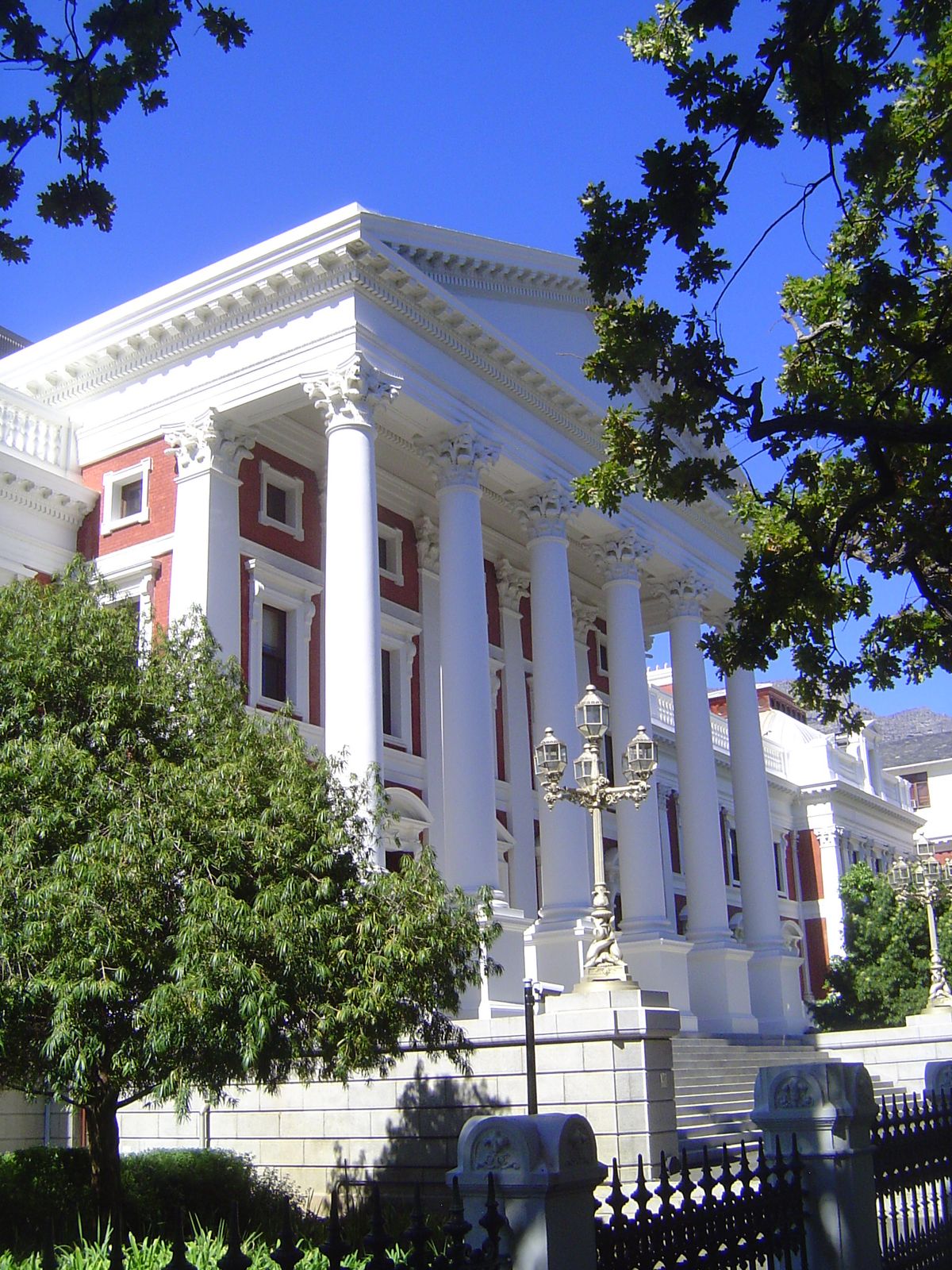 The nearby Parliament or House of Assembly, from 1884, is British not only in its classicism but in its materials, all imported. The archite