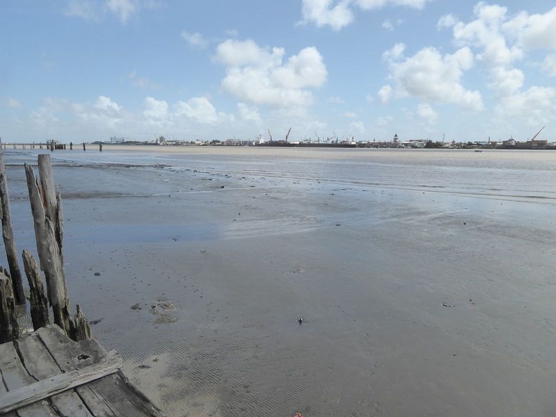 The blue hulk of the Marriott marks the river's mouth. The pyramidal tower at the right center is the Stabroek Market, which is the location