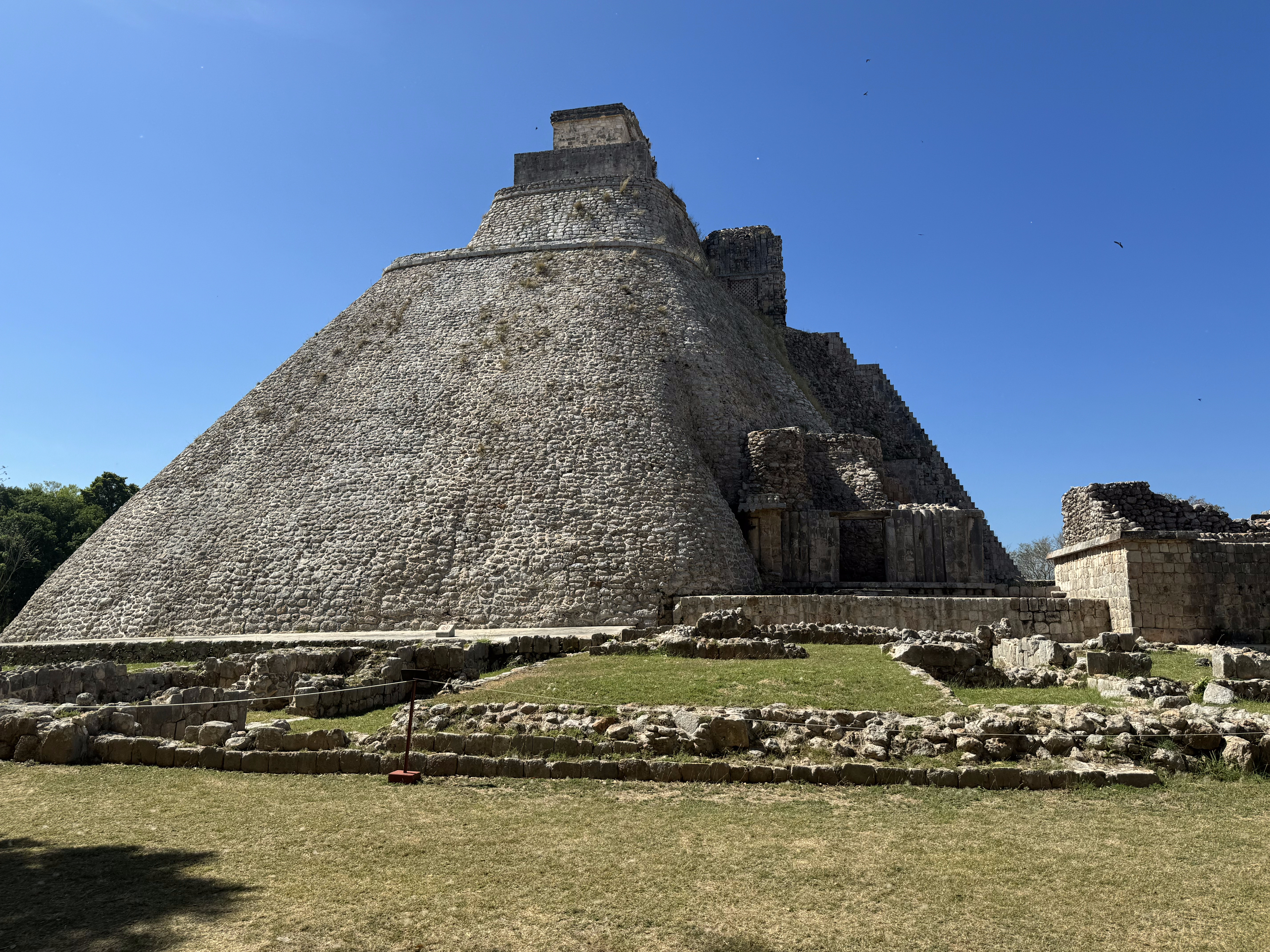 There's one temple at the top and another at the base.  That's because the pyramid was built in stages.  Archaeologists don't know much abou