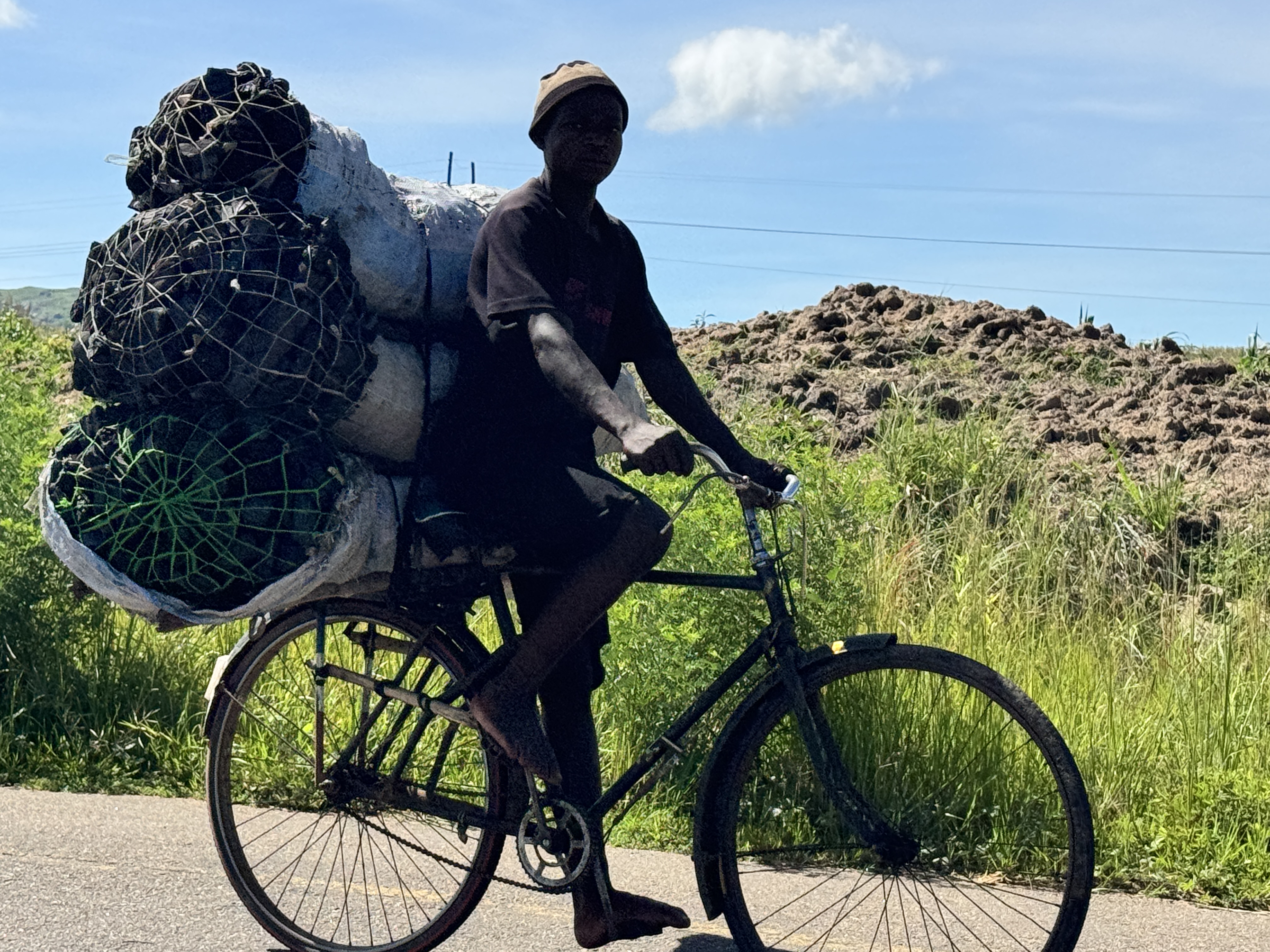 People still do need to cook, and the cheapest fuel is charcoal, carried to trading centers by bicycle.  It will be repacked in one- or two-