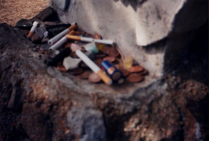 The shelf for unsmoked cigarettes was recently removed, but cigarettes are still a common gift, along with money.