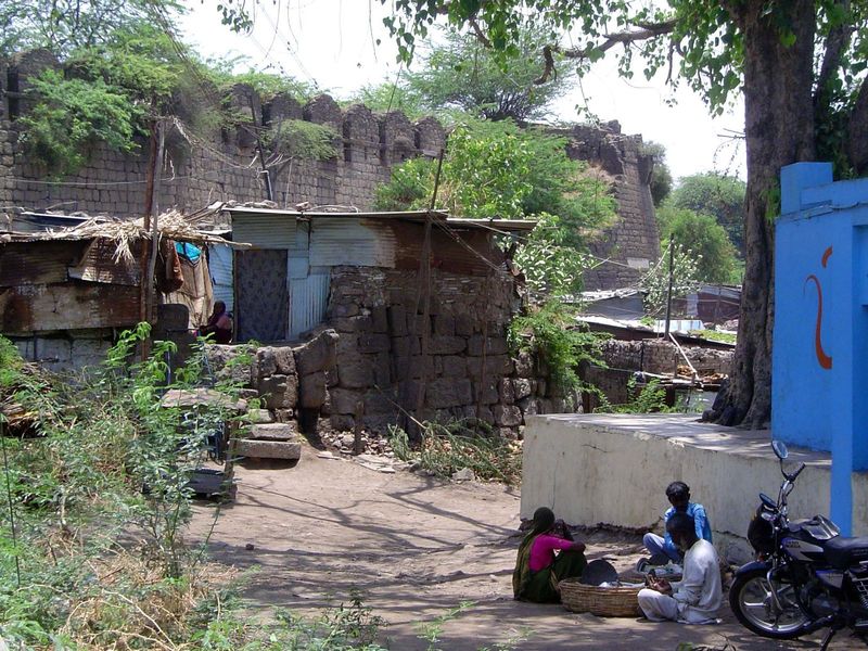 The city wall, six miles in length, had an accompanying, 50-foot-wide moat. Squatters have taken up residence on the spot.