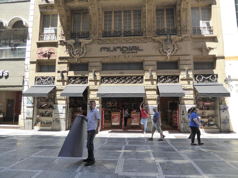 The facade of the older building remains loyal to the 19th century, though the original owner would probably be appalled to see a shoe store