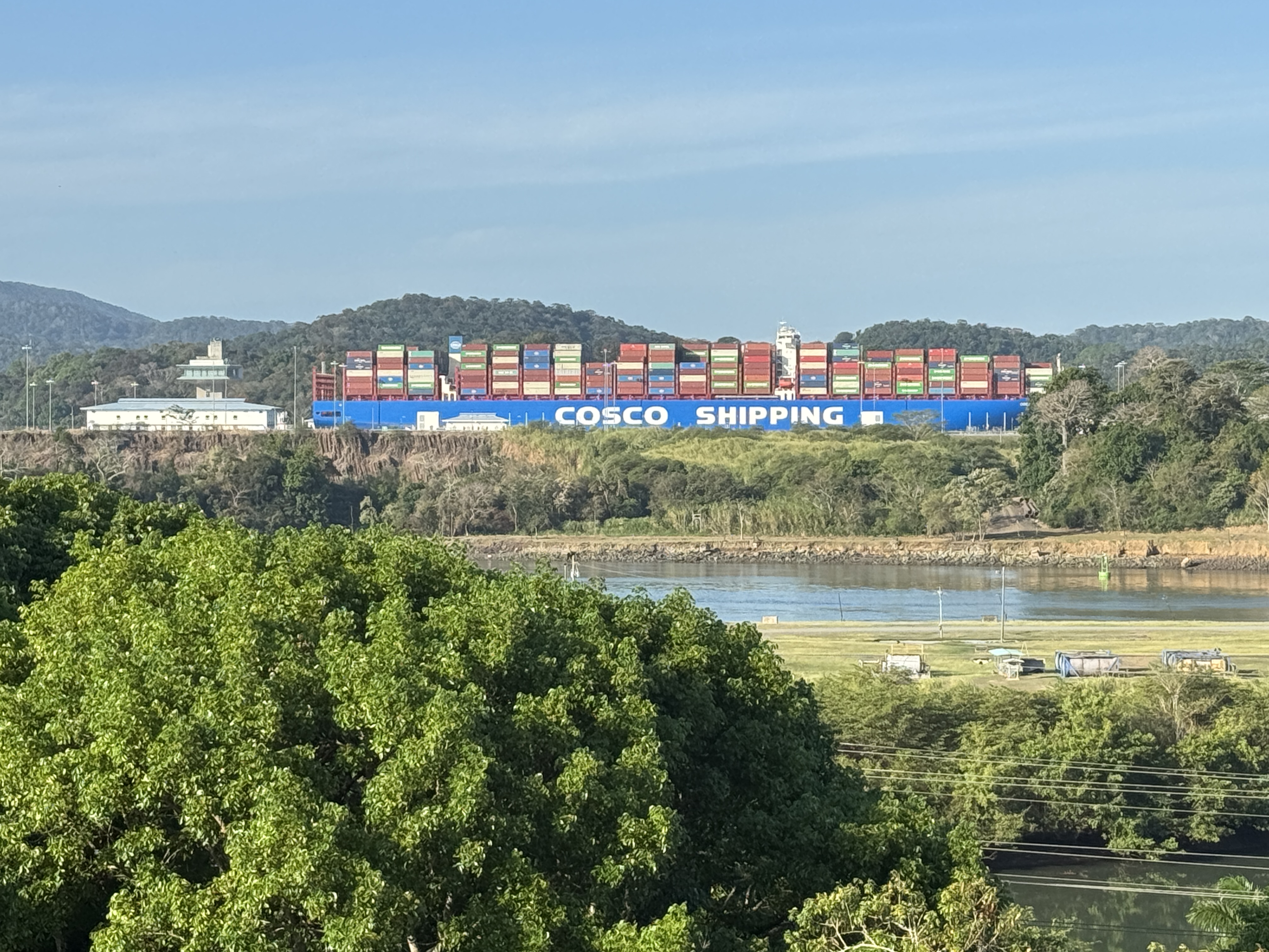 Zoomed.  One after another, but they move so slowly that the Canal, even expanded, handles only about three dozen ships daily.