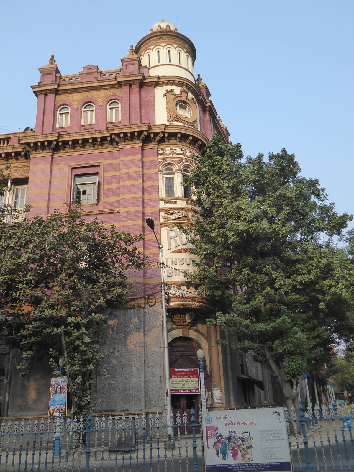 The main entrance is gradually being hidden by foliage.